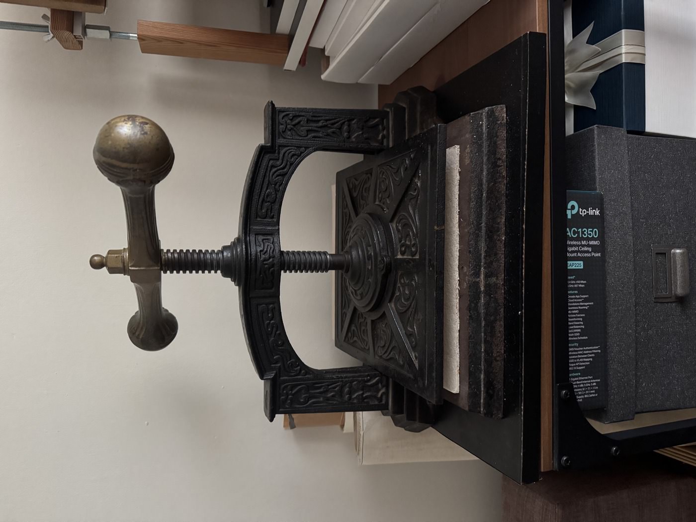 An antique cast-iron book press
